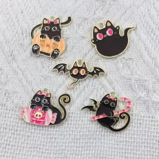 Gothic cat charms.
